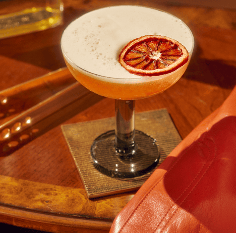 cocktail with orange garnish