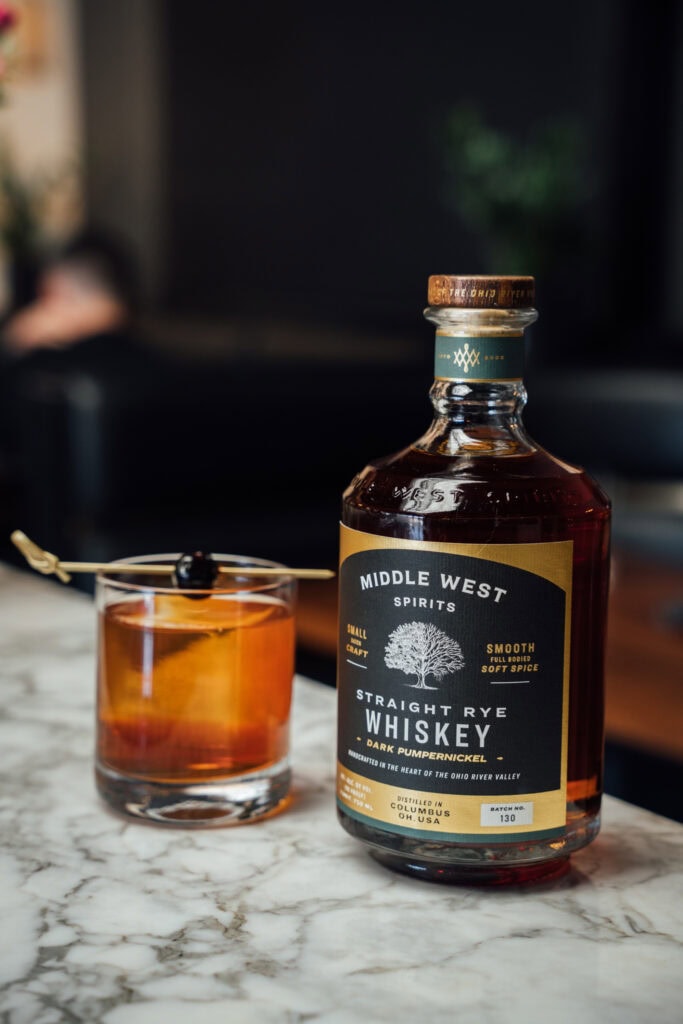 manhattan with whiskey bottle