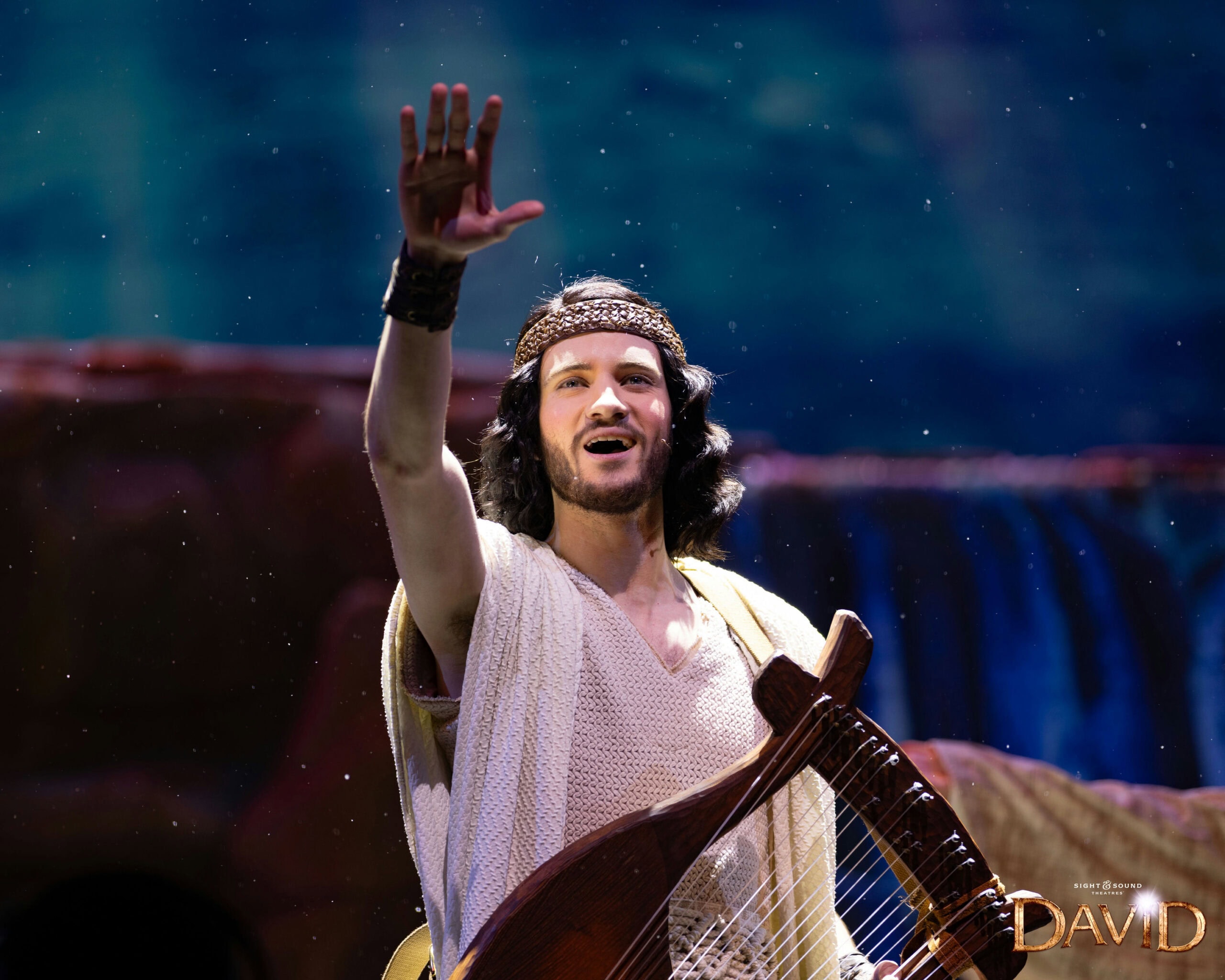 DAVID plays the harp