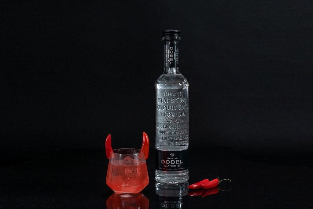 glass with horns and DObel tequila bottle